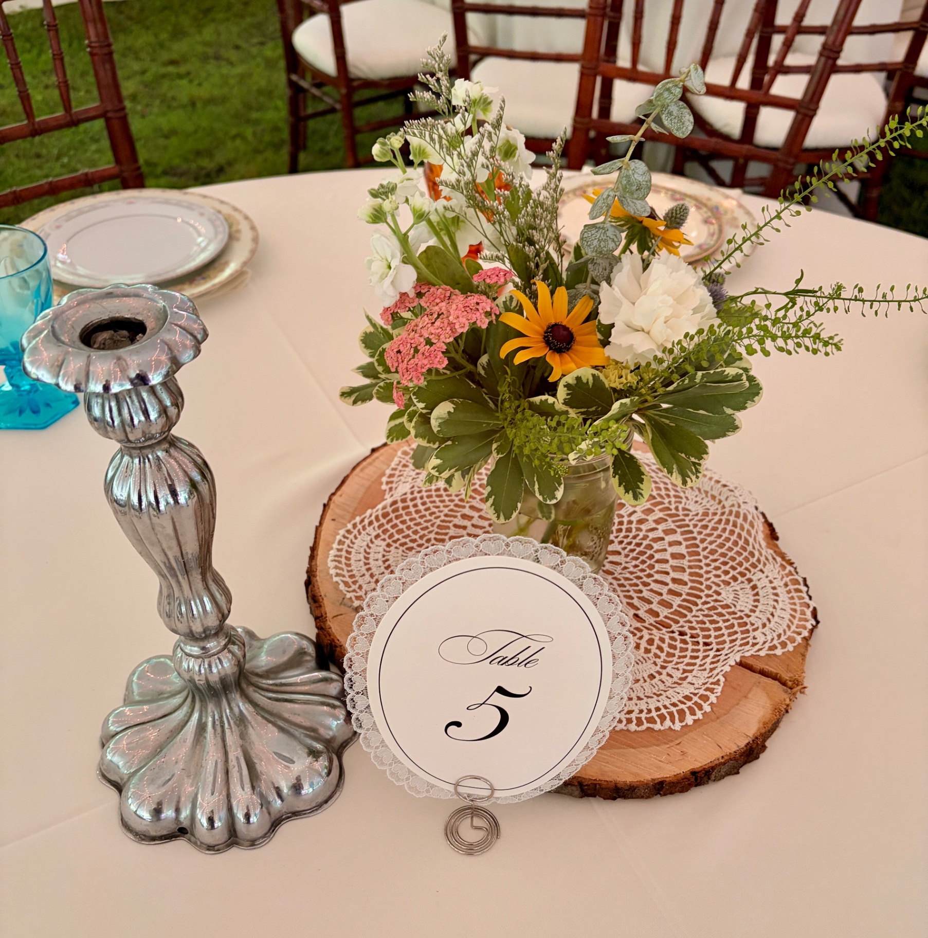 Rustic mason jar wildflower centerpiece for wedding table