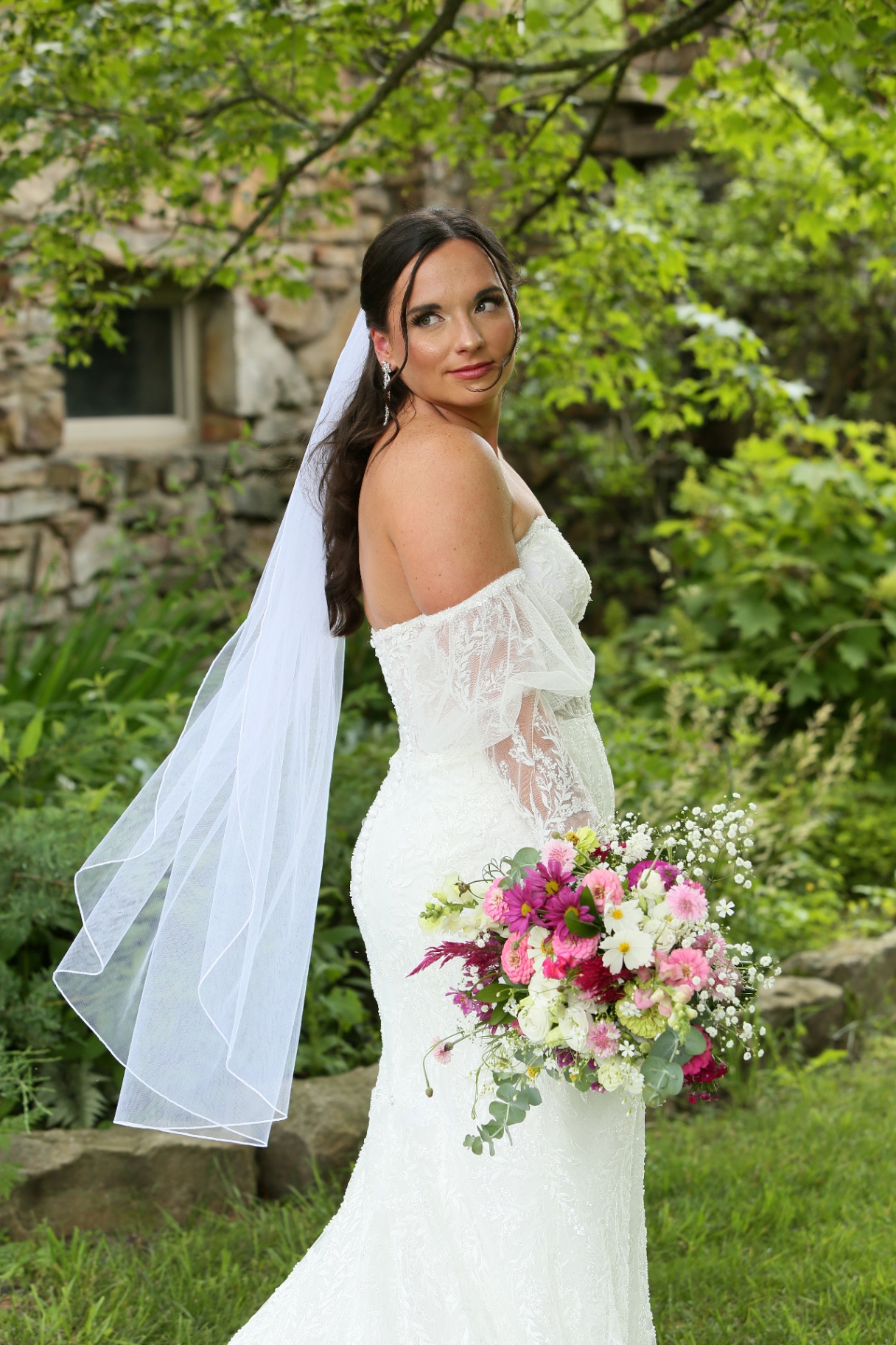 Bride holding a wildflower bouquet by Hidden JEM Farm