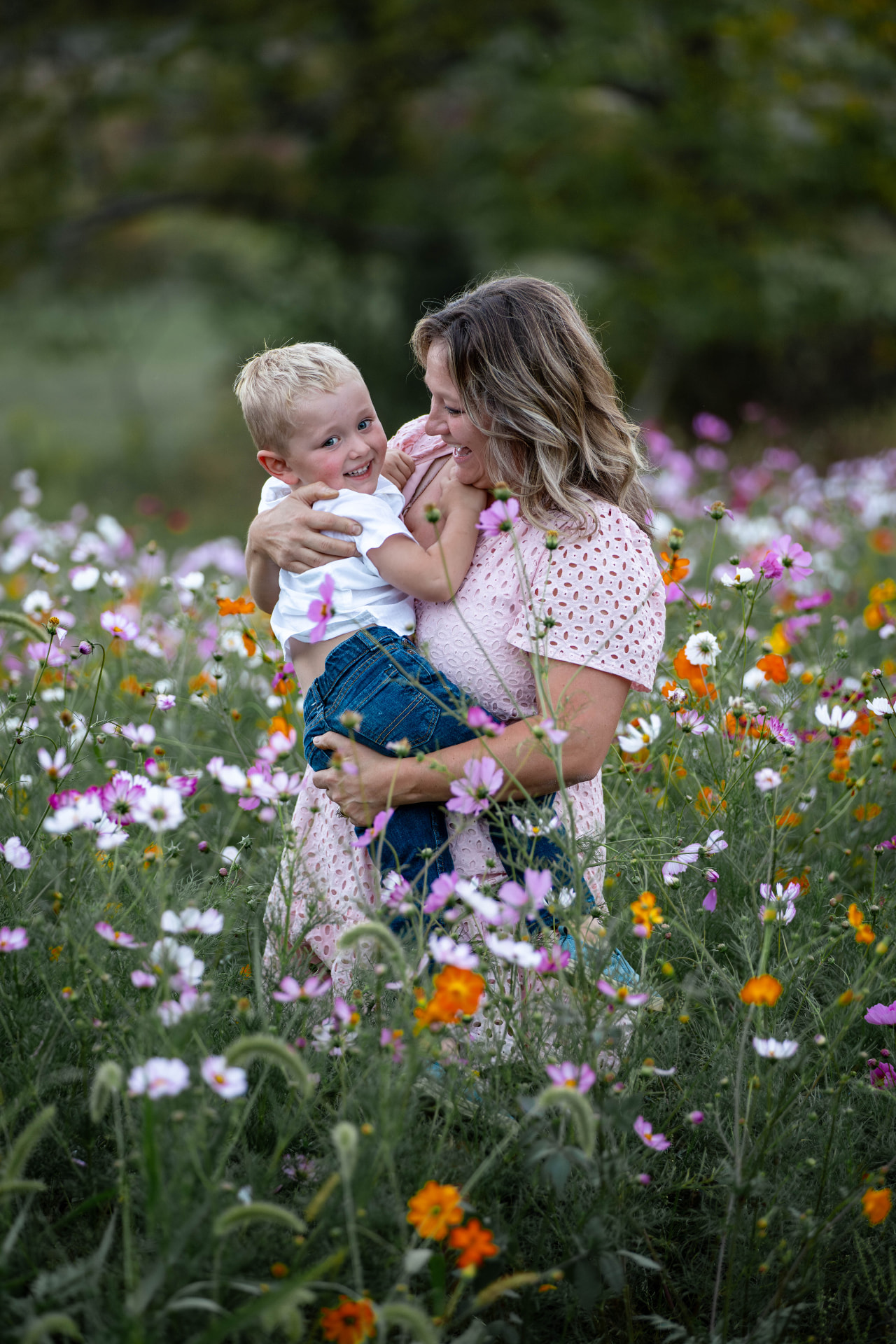 Mother and son during a portrait session in the wildflower field at Hidden JEM Farm